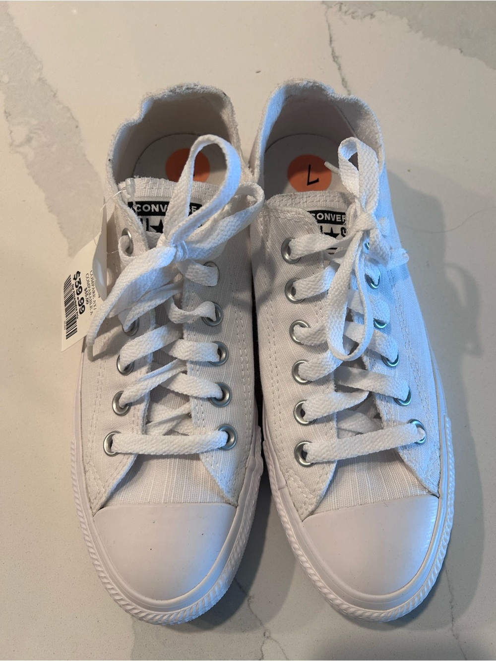Converse white low-top canvas sneakers